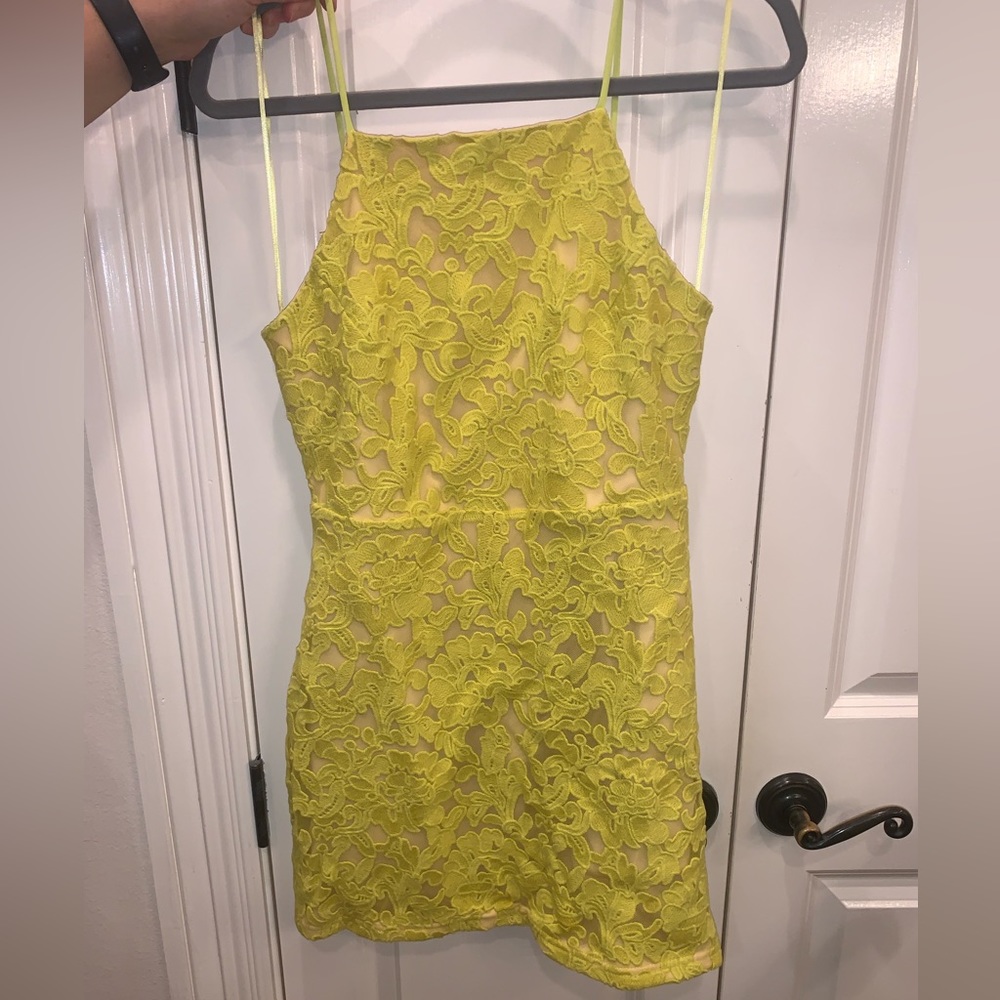 Yellow lace mini dress with open back